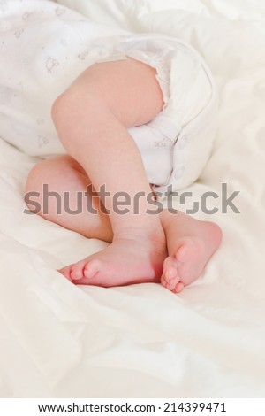 little feet of newborn baby sleeping peacefully