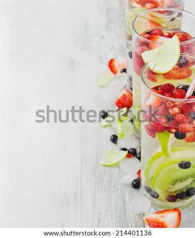 cool drink with fresh berries and fruit on the old wooden background.copy space background. health and diet food