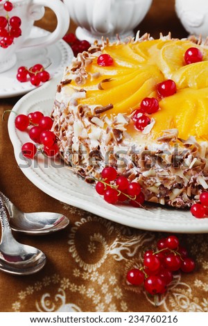delicious cake with apricots and red currant on a celebratory table. festivals and events.