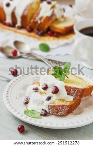 slices of freshly baked cupcakes with icing and fresh cranberries on the holiday table. holiday meal. selective focus