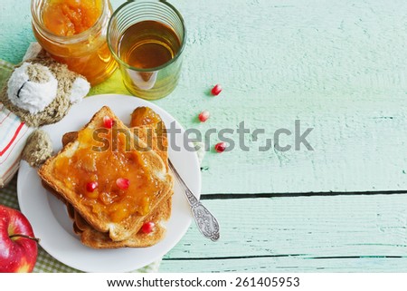 useful for children breakfast of toast with jam and fruit on green wooden table. children food concept. copy space background.top view