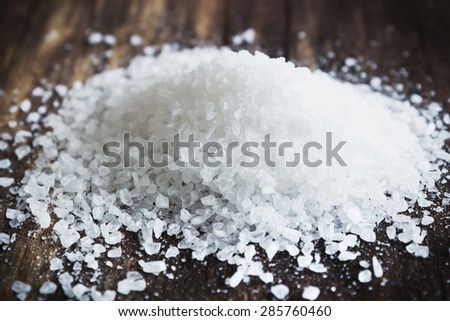cooking salt close up on an old wooden background. food ingredients. selective focus