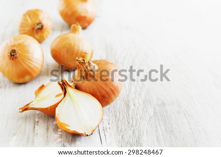 onions on old wooden background. vintage style. vegetables from his garden.selective focus