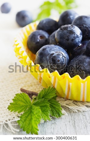 fresh blueberries in paper cups on the table. gifts of summer. close-up.health and diet food. selective focus