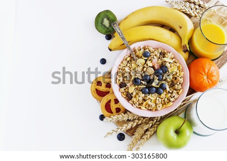 muesli with berries and fruit on a white background. healthy breakfast. copy space background