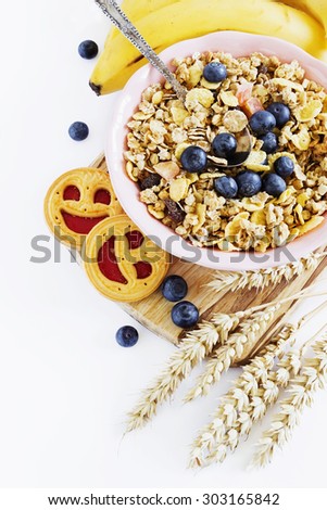 muesli with berries and fruit on a white background. healthy breakfast