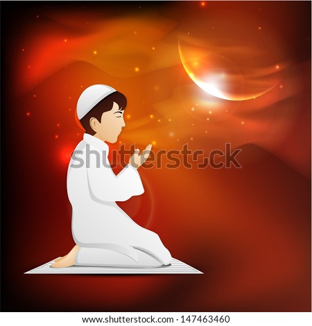 Young Muslim boy in traditional dress praying (Namaz, Islamic prayer) in shiny moon light night for Eid Mubarak festival.