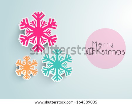 Merry Christmas celebration greeting card or invitation card with beautiful snowflakes on blue background.