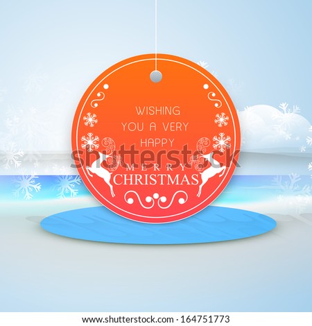 Creative Merry Christmas celebration tag, label or sticker on blue stage, nature background.