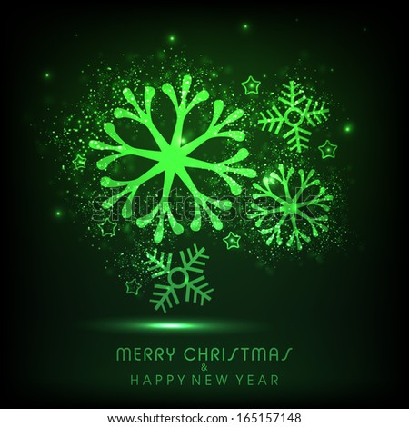 Merry Christmas celebration greeting card or invitation card with shiny snowflakes in green color on dark background.