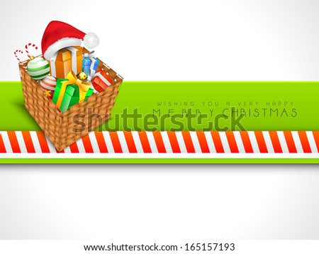 Merry Christmas celebration greeting card or invitation card with wooden basket with full of gift boxes on abstract grey and green background.