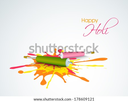 Indian festival Happy Holi celebrations concept with pichkari (colour gun) on colours splash background.