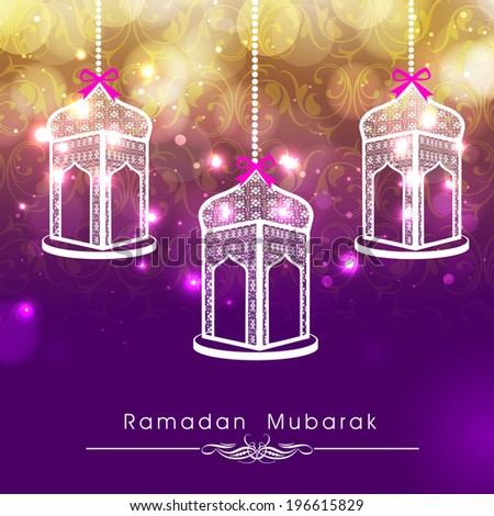Hanging intricate arabic lanterns on shiny abstract background for celebrations of holy month of Ramadan Kareem.