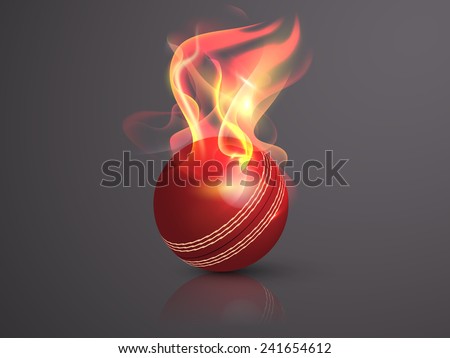 Red cricket ball in flame on glossy grey background.