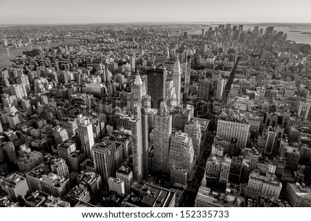 Aerial view of Manhattan below 30th Street including Midtown, Chelsea, East Village, Lower Manhattan and the Financial District at the southernmost tip. Black & white photography of NYC.