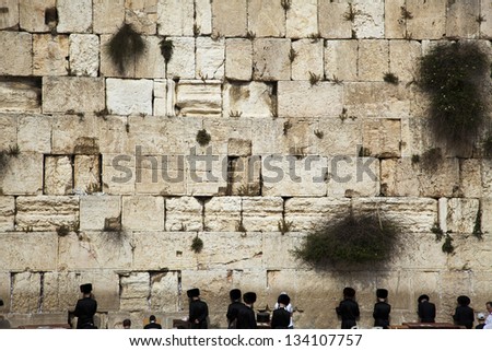 JERUSALEM - MAY: Prayers at the Western Wall, one of the most sacred places to the Jewish religion, on May 2012, in Jerusalem, Israel.