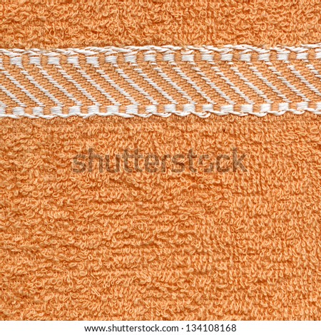 High resolution close up of a beige towel cloth with white stripes.