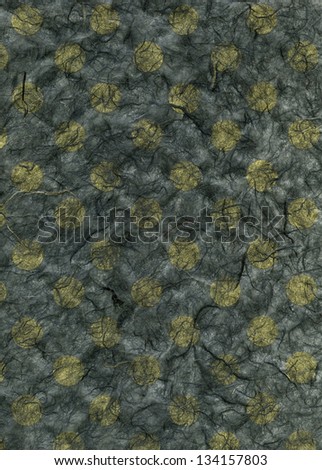 High resolution scan of yellow polka dots embedded in dark gray rice paper.
