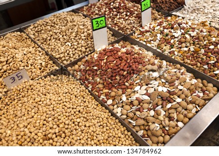 Various types of pulses & nuts displayed for sale in a middle-eastern market, located in the old town of Acco, Israel.