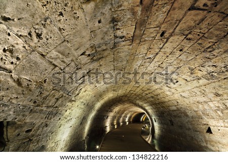 The Templar tunnel in the old town of Acco, Israel. The Templar tunnel is an underground tunnel residing beneath the town\'s streets.
