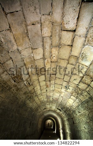 The Templar tunnel in the old town of Acco, Israel. The Templar tunnel is an underground tunnel residing beneat the town's streets.
