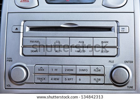 A close up on a metallic-gray colored radio and CD player.