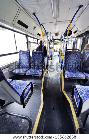 TEL AVIV - MAR 4: A rather empty \'Dan\' company bus on a rainy winter morning. The few people on the bus are waking commuters making their way to another day of work on March 4 2012 in Tel Aviv, Israel