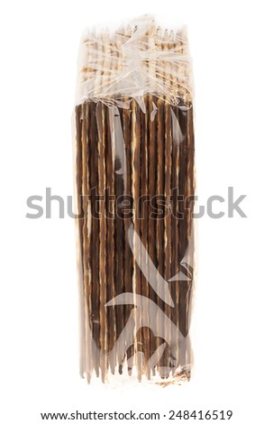 Side view of a nylon wrapped package of Jewish Matzah bread, the substitute for bread on the Jewish Passover holiday, isolated on white background.