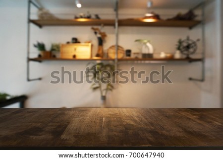Empty wooden table in front of abstract blurred background of restaurant. can be used for display or montage your products.Mock up for display of product