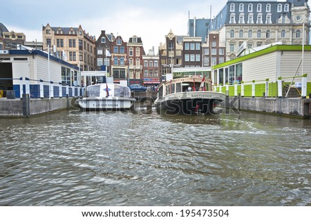 AMSTERDAM, NETHERLANDS - CIRCA MAY 2014: On a cruise along Amsterdam channels