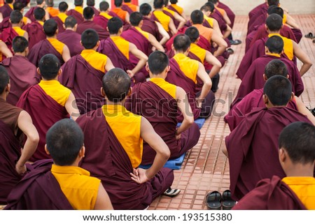 Kushalnagar, India - JUNE 25th 2009 - Buddhist Monks sitting in meditation in a monastery in Kushalnagar, India June 25th 2009.