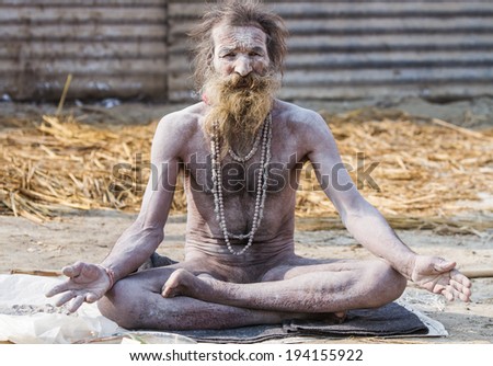 ALLAHABAD, INDIA - FEB 13 - A hardcore Hindu renunciate sits in meditation during the festival of Kumbha Mela on February 13th 2013 at Allahabad, India.