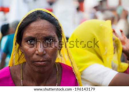 HARIDWAR, INDIA - AUG 9 - A traditionally dressed Indian woman stares at the camera on August 9th 2010 at Haridwar, India.