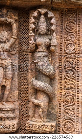 An ancient carving of a Naga (half men, half snake deitiy) at the Sun Temple in Konark, India.