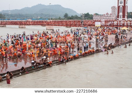 HARIDWAR, INDIA - AUGUST 10 - Hindu Pilgrims gather on the banks of the holy river in prepartion for Ganga Artik on August 10th 2010 at Haridwar, India.