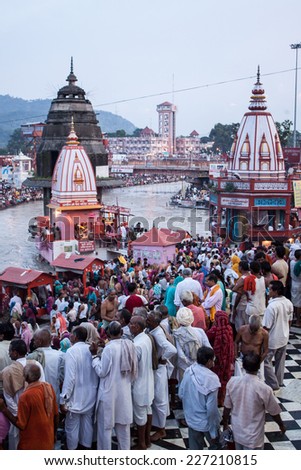 HARIDWAR, INDIA - AUGUST 10 - Hindu Pilgrims gather on the banks of the holy river in prepartion for Ganga Artik on August 10th 2010 at Haridwar, India.