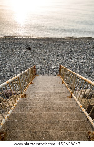 stairway to the rocky beach during sunset at the Black Sea - Turkey