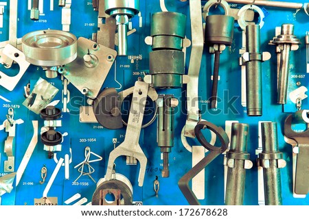Tools in auto repair garage at wall