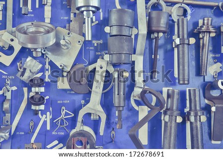 Tools in auto repair garage at wall