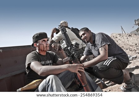 MISRATA, LIBYA, 20 MAY 2011: rebel fighters at the Dafniya front line, 20 km west of Misrat, facing Gaddafi forces in Zlitan.