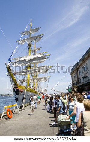 BOSTON - JULY 11: Long lines wait to board the Romanian Tall Ship Mircea on July 11, 2009 in Boston during the Tall Ship Exposition.  Two million visitors toured the tall ships.
