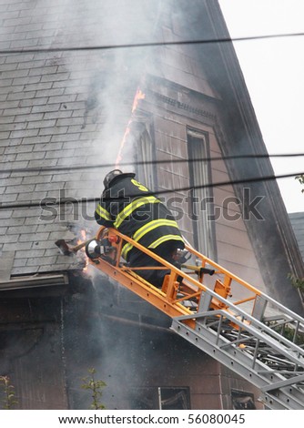 SOMERVILLE, MASSACHUSETTS - JUNE 27: Firefighters from at least 4 fire house battle a blaze at 111 Glenwood Road June 17,2010 in Somerville, MA