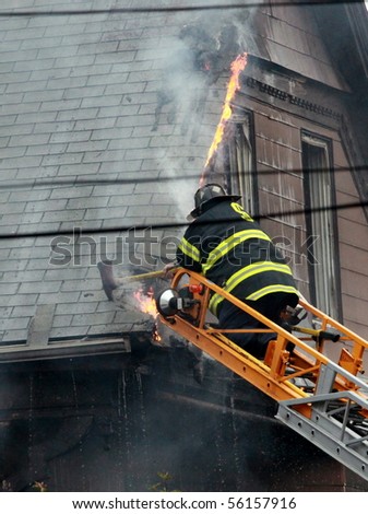 SOMERVILLE, MASSACHUSETTS - JUNE 27: Firefighters from at least four fire houses battle a blaze at 111 Glenwood Road June 17,2010 in Somerville, MA