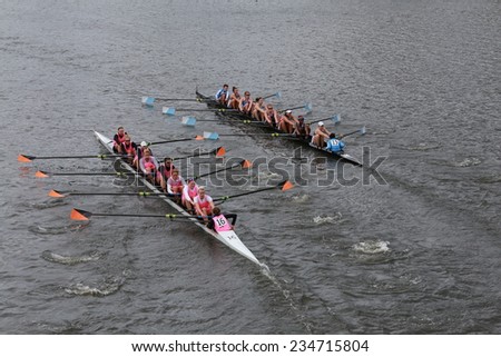 BOSTON - OCTOBER 19, 2014: Princeton University (left) and Columbia University(right)  races in the Head of Charles Regatta Women\'s Championship Eights