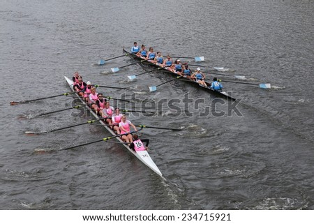 BOSTON - OCTOBER 19, 2014: Princeton University (left) and Columbia University(right)  races in the Head of Charles Regatta Women\'s Championship Eights