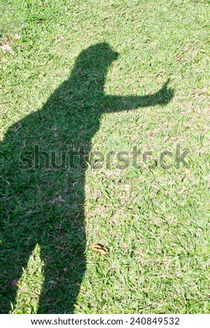 Woman shadow on grasses