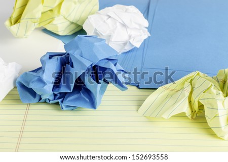 Different styles of paper scattered and crumbled.