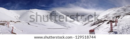 Panoramic view of  snow mountains of Tibet from a 5200 m mountain pass.
