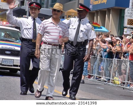 TORONTO, CANADA - JUNE 25: Chiefs of the Ontario Provincial Police marching in Toronto Pride. Toronto Gay Pride Parade, June 25, 2006