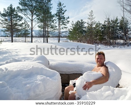 stock photo Naked man enjoying snow outdoor after hot sauna
